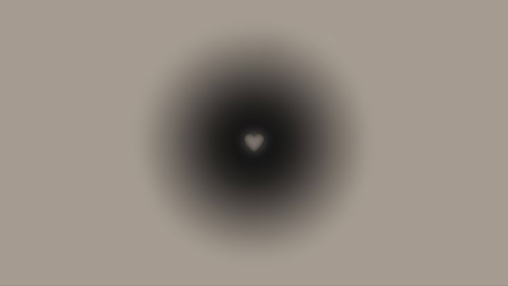 a black hole in the middle of a gray wall with a white heart on it