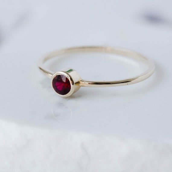 Ruby Ring, Ruby Gold Ring, Dainty Gold Ring, Stacking Gold Ring, 14K Gold Ring, Simple Stone Ring, Gold Bezel Ring, July Birthstone RingA modern and timeless 14K gold ring with a natural Ruby gemstone. A perfect gold ring for women, stacking and minimalist that adds glam to every outfit. 100% handcrafted with love!D E T A I L S● Metal: 14K solid gold, 14K white gold or 14K rose gold● Gemstone: Ruby● Stone Diameter: 3.3mmR I N G ∙ S I Z I N GFor General Reference:● we use standard US Ring Sizing● Yellow Gold Garnet Rings, Yellow Gold Garnet Rings With Round Cut, Elegant Red Gemstone Stackable Rings, Yellow Gold Garnet Birthstone Ring, Elegant Stackable Ruby Birthstone Ring, Red Birthstone Stackable Rings Fine Jewelry, Elegant Stackable Garnet Gemstone Rings, Fine Jewelry Red Birthstone Stackable Rings, Elegant Garnet Gemstone Stackable Rings