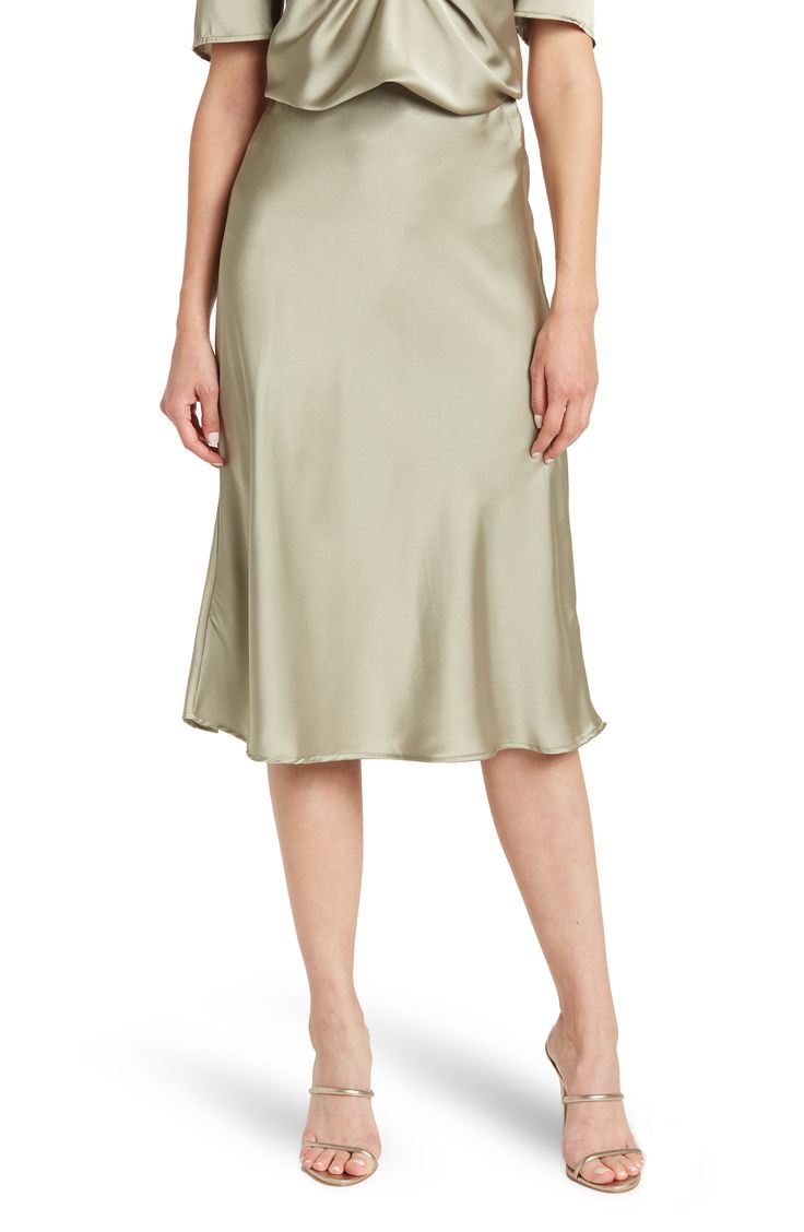 Elevate your wardrobe with this pull-on bias satin midi skirt for elegant, feminine style. 31" length (size S) Elasticized waist Pull-on style Satin construction 97% polyester, 3% spandex Machine wash cold, line dry Made in USA Model’s stats for sizing: 5’10” height, 34” bust, 27” waist, 35” hips. Model is wearing size S. Spring Formal Satin Skirt, Chic Silk Knee-length Bottoms, Sleek Spring Pencil Skirt, Midi Length, Chic Knee-length Silk Bottoms, Relaxed Midi Skirt With Bias Cut, Sleek Spring Midi Skirt, Silk Knee-length Lined Skirt, Knee-length Silk Lined Skirt, Silk Pencil Skirt For Formal Spring Occasions