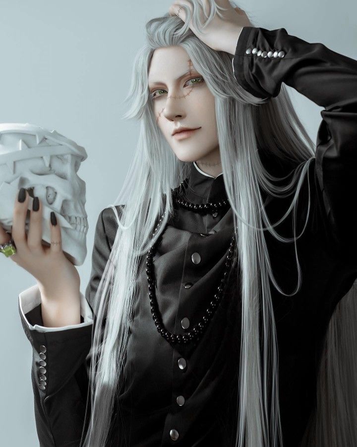 a woman with long grey hair holding a skull