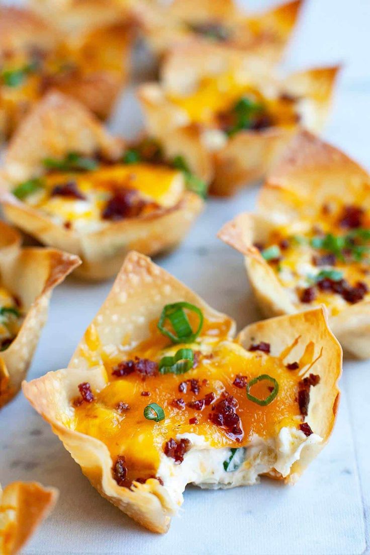 small appetizers are lined up on a table