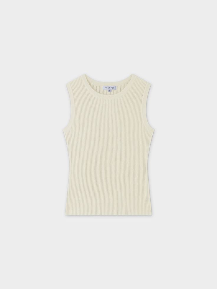 Expertly designed for comfort and style, our Sleeveless Ribbed Crew-Ivory is the perfect addition to any outfit. Pair it with our matching cardigan for the perfect set. Everyday Ribbed Cream Tops, Classic Ribbed Sleeveless Vest, Everyday Cream Ribbed Top, Classic Sleeveless Ribbed Top, White Classic Crew Neck Tank Top, Classic Beige Sleeveless Tank Top, Casual Cream Sleeveless Knit Top, Casual Sleeveless Cream Knit Top, Chic White Vest For Everyday Wear