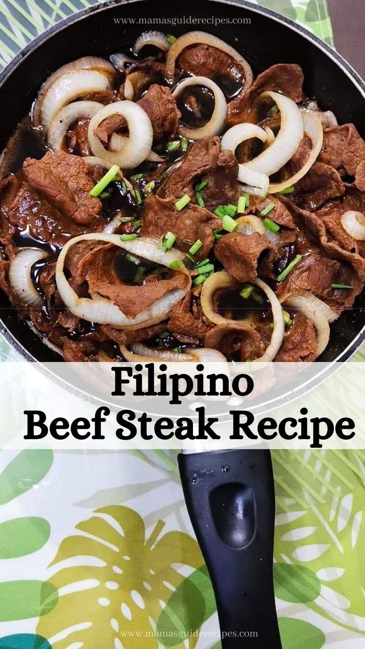 a skillet filled with beef and onions on top of a table