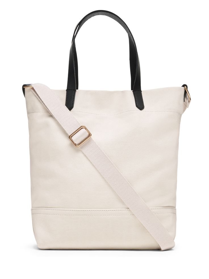 Our sturdy, cotton canvas tote is now available in a smaller size.  Use it as a daytime bag for your wallet and water bottle, or take it to work as a lunch bag.  Sturdy leather handles.  Snap tab closure.  One internal card slot.  Detachable shoulder strap.  Cotton canvas lining.  Height: 12. 5" (31. 75cm) Top width: 13" (33cm) Bottom width: 10" (25. 4cm) Depth: 5" (12. 7cm) Handle drop: 7. 5" (19cm) Canvas Crossbody Bucket Bag For On-the-go, Large Capacity Duck Canvas Bag For On-the-go, Daily Use Canvas Crossbody Bucket Bag, Daily Use Shoulder Satchel With Snap Closure, Practical Rectangular Canvas Satchel, Versatile Canvas Bucket Bag With Removable Pouch, Versatile Canvas Bucket Bag, Versatile Canvas Bucket Bag For On-the-go, Double Handle Canvas Bag For On-the-go