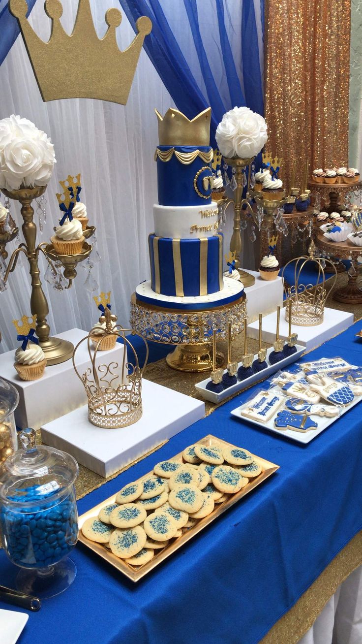 a table with blue and gold desserts on it