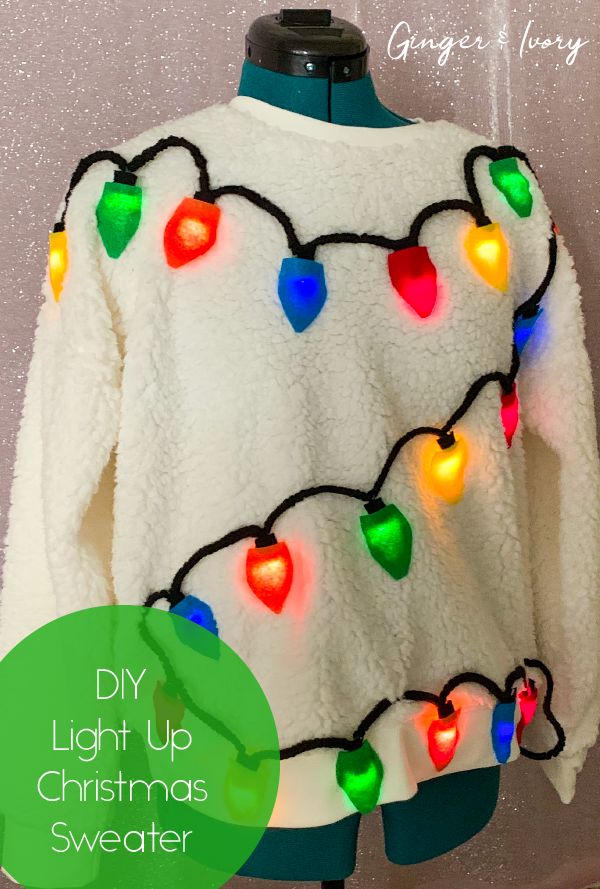 a white sweater with christmas lights on it and the words diy light up christmas sweater