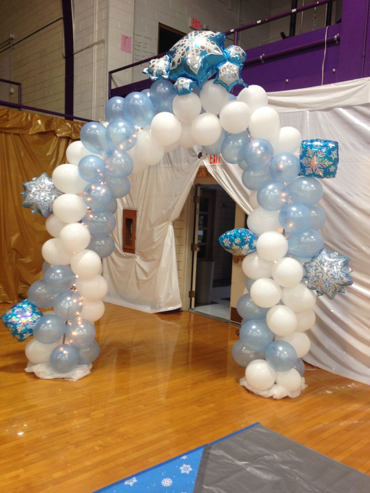 an arch made out of balloons and snowflakes