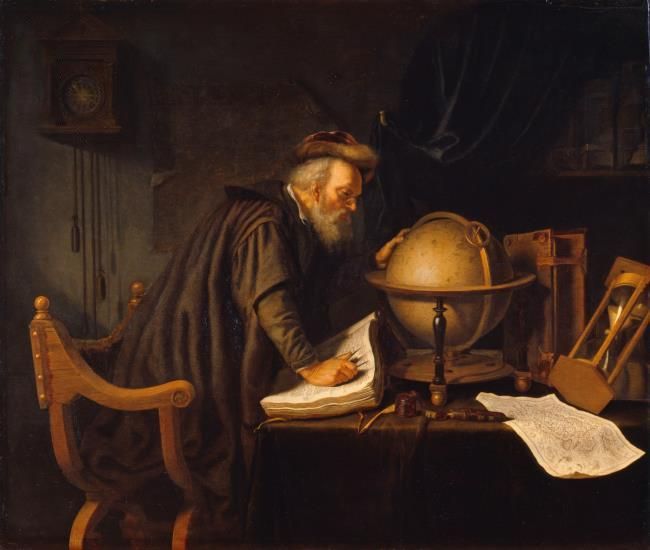 an old man is writing in front of a globe and other items on a table