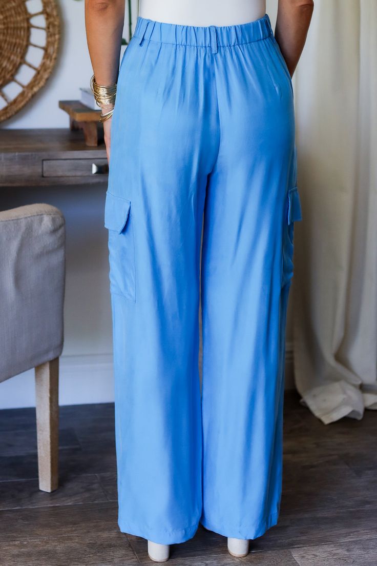 Get ready to strut your style this spring with our Laura cargo pants! With a gorgeous electric blue shade, these pants will add a pop of color to any outfit. Plus, their cargo design provides plenty of pockets for all your essentials. Step out in style and functionality with Laura! 100% Rayon Color: Flat Blue with Shimmer Button/ Zipper Closure Multi Pockets Half Elastic Waist BAND Light Weight Utility Cargo Style Straight Leg Belt Loops True to size Model is wearing a size Small. She is 5'6". 1 Casual Blue Full-length Cargo Pants, Blue Wide Leg Relaxed Fit Cargo Pants, Blue Relaxed Fit Wide Leg Cargo Pants, Blue Wide Leg Cargo Pants With Relaxed Fit, Blue Full-length Cargo Pants With Multiple Pockets, Blue Full Length Cargo Pants With Multiple Pockets, Casual Blue Pants With Cargo Pockets, Blue Relaxed Fit Utility Bottoms, Blue Straight Leg Parachute Pants In Cargo Style