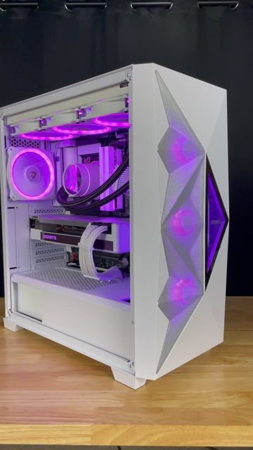 a white and purple computer case sitting on top of a wooden table