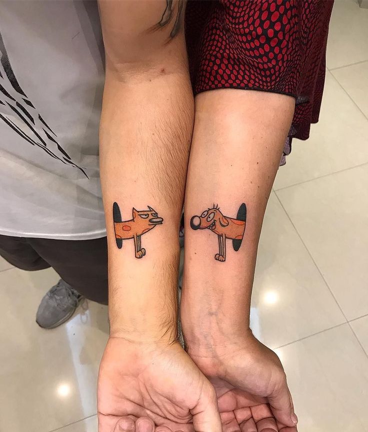 two people with matching tattoos on their arms