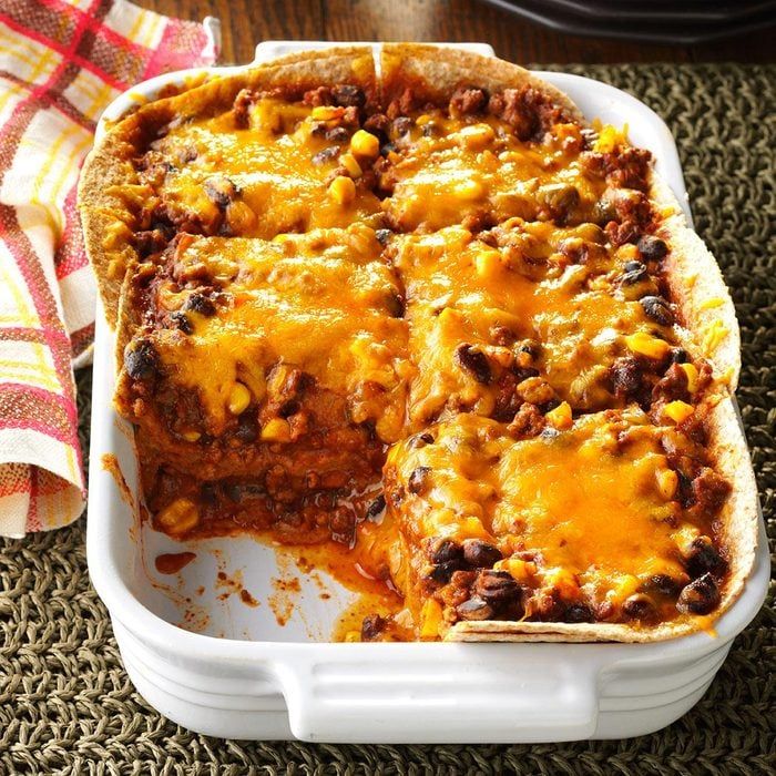 a casserole dish filled with meat and cheese