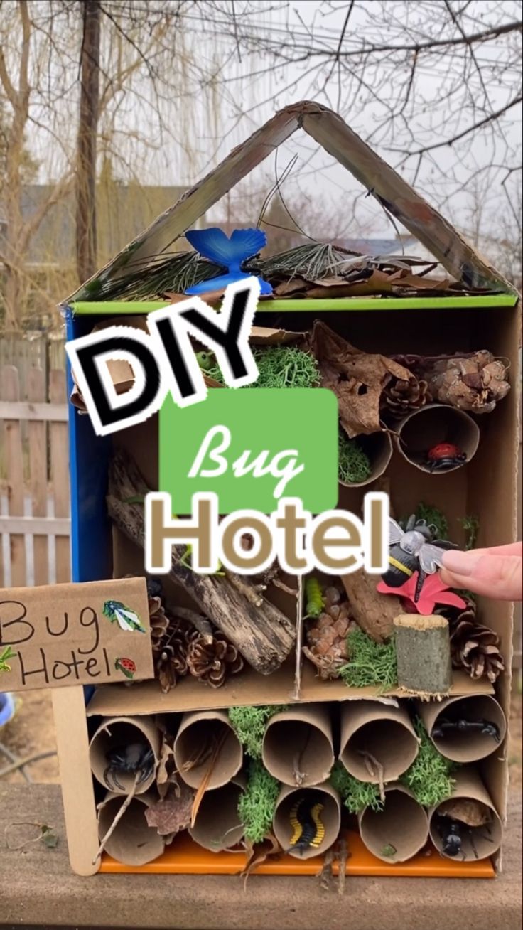 a cardboard box filled with lots of different items and the words diy bug hotel