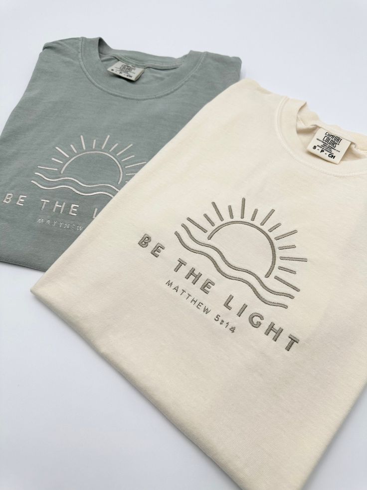 Embroidered Be The Light Matthew 5:14 Comfort Colors® Shirt | Inspirational Christian Tee | Religious Faith Clothing | Bible Verse Gifts The item in the first picture features Cream thread color on a Pepper Comfort Colors T-shirt. The item in the first picture features Sand thread color on a Bay Comfort Colors T-shirt. The item in the first picture features Doe Skin Beige thread color on an Ivory Comfort Colors T-shirt. The item in the first picture features Cream thread color on a Yam Comfort C Christian Printed Tshirts, Unisex Christian Shirt Ideas, Cute Jesus Shirts, Cute Christian T Shirts, Christian Tshirt Design Ideas Vinyl, Cricket Projects Craft Ideas Shirts, Christian Shirt Design Ideas, Merchandise Ideas Clothing, Men T Shirt Design Ideas