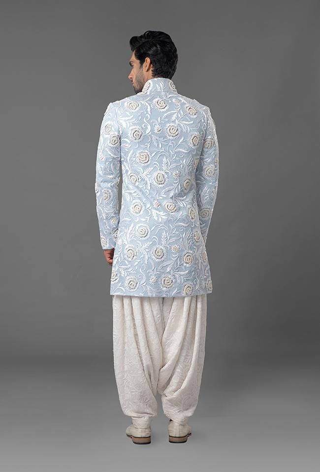 Light Blue Embroidered Sherwani Patiyala Salwar Pattern Mens, Kurta Patiyala Men, Designer Blue Kurta With Intricate Embroidery, Blue Bollywood Bandhgala With Floral Embroidery, Designer Cotton Fitted Sherwani, Designer Fitted Cotton Sherwani, Blue Bollywood Nehru Jacket With Intricate Embroidery, Designer Embroidered Blue Sherwani, Ceremonial Blue Bandhgala With Chikankari Embroidery