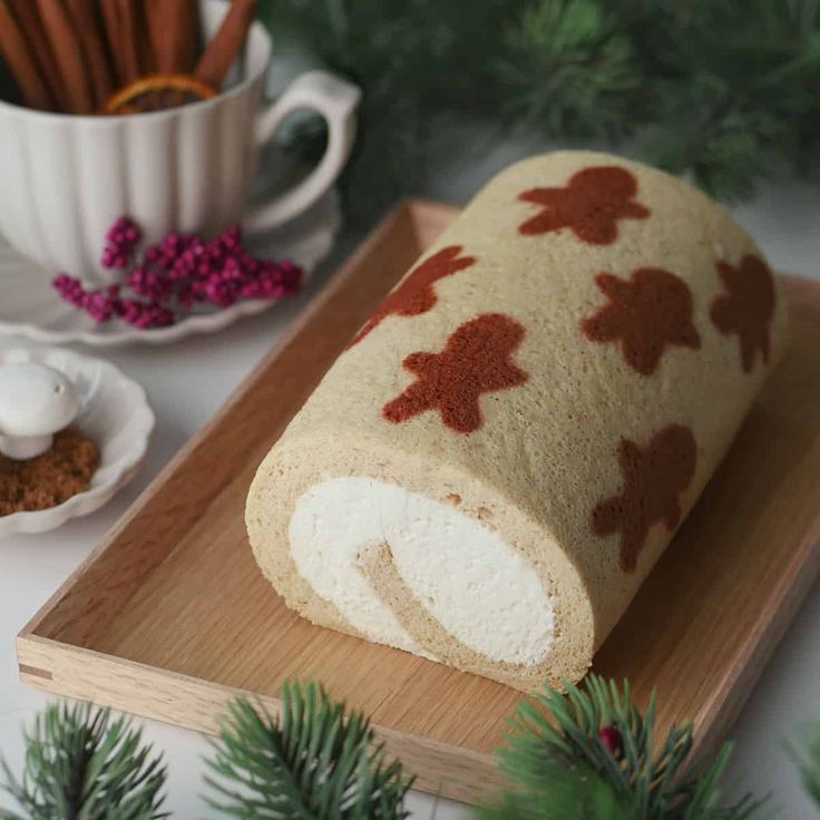 a loaf of bread sitting on top of a wooden cutting board next to a cup and saucer