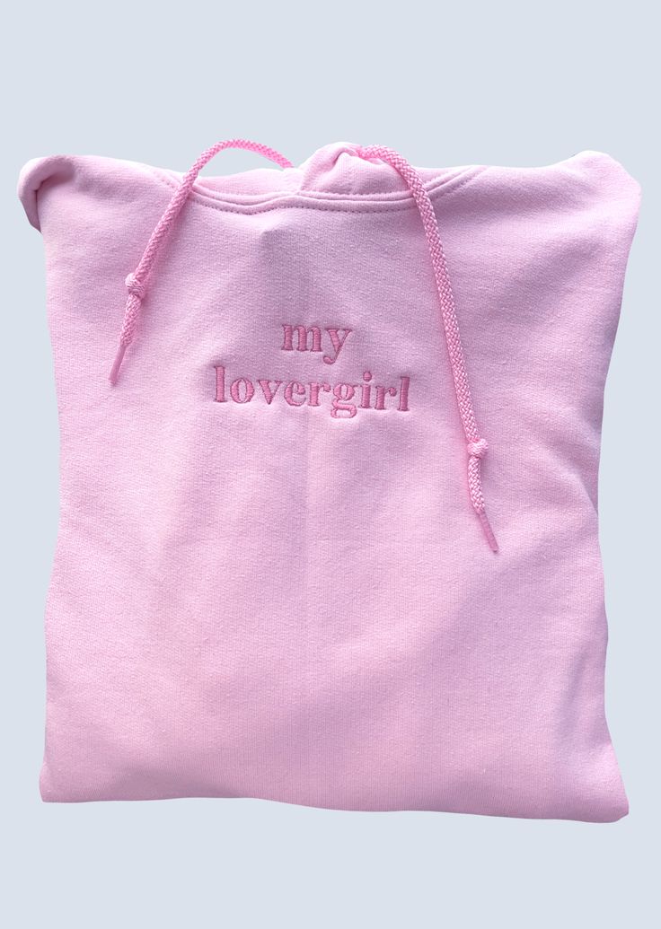 a pink tote bag with the words my lovergirl embroidered on it's side