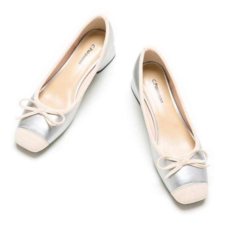 two pairs of white shoes with bows on the toe and heel, all in satin fabric