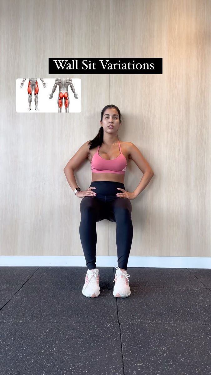 a woman is sitting on the wall with her hands on her hips and arms behind her back