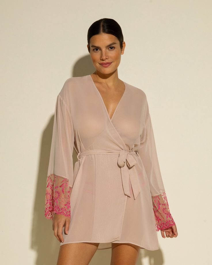 Sheer robe with lace sleeves. Beautifully detailed rigid semi-sheer lace. Mid-thigh length. Removable tie at waist. Lace trimmed long sleeves. Hand wash, do not dry in dryer. Long Sleeve Lace Sleepwear For Loungewear, Long Sleeve Lace Sleepwear For Lounge, Elegant Long Sleeve Lace Sleepwear, Lace Long Sleeve Sleepwear For Wedding Night, Spring Long Sleeve Sleepwear With Tie Waist, Long Sleeve Tie Waist Sleepwear For Spring, Feminine Long Sleeve Lace Sleepwear, Spring Sheer Long Sleeve Kimono, Sheer Long Sleeve Robe For Wedding Night