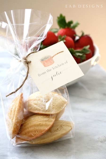 some cookies and strawberries in a bag on a table