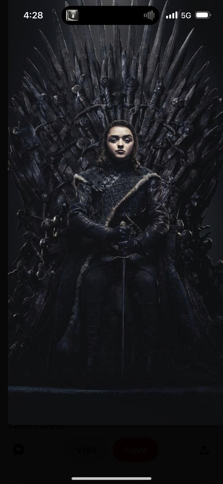 a woman sitting on top of a iron throne