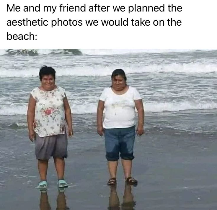 two women standing on the beach next to each other