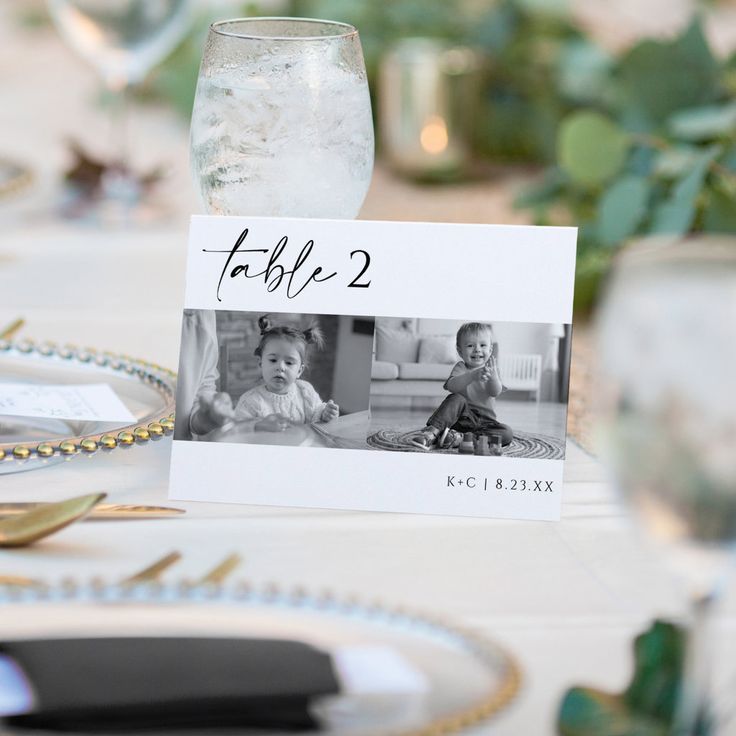 a table set with place cards, silverware and wineglasses for two children