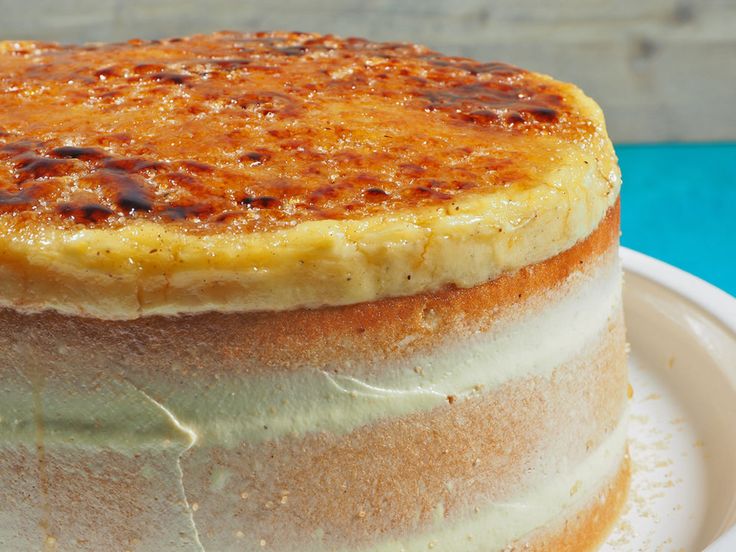 a stack of pancakes sitting on top of a white plate