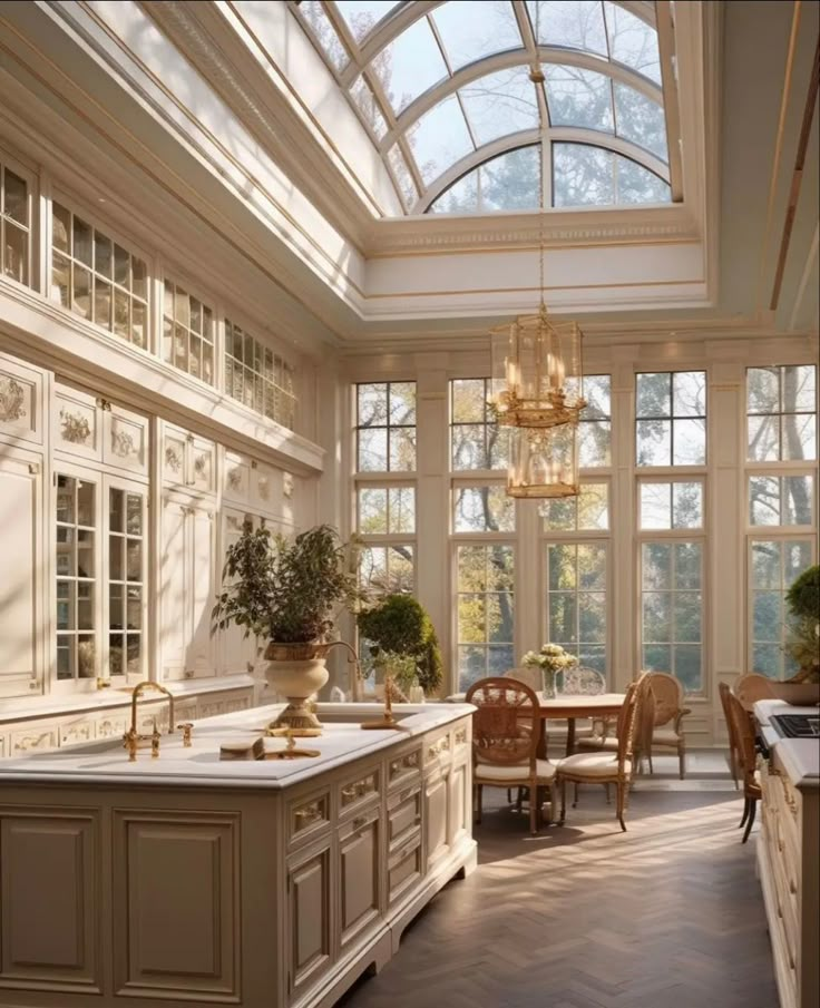 a large kitchen with lots of windows and cabinets