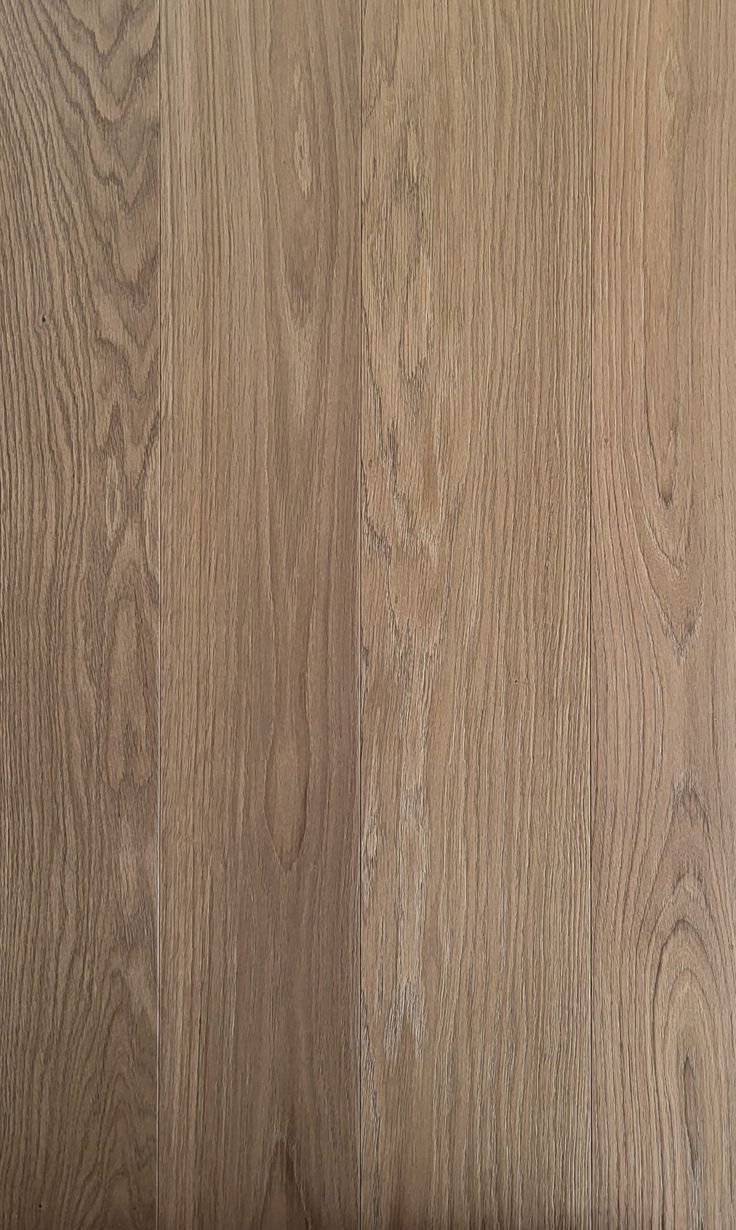 a close up view of the wood grains on this flooring project, which has been finished in white oak