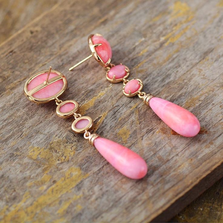 Get the Charming Bohemian beauty inspired by Nature with our new " Lilly Pink Dangle Earrings", Hand made with Semi precious Natural stones with Fancy pink Colors   Features & Specifications Material : Semiprecious Stone, Metal Making Technics : Full Handmade Size : Around 5.5-6cm Product condition : 100% New and Exquisite Quality. Pink Chandelier Drop Earrings For Gift, Pink Teardrop Chandelier Earrings For Gift, Pink Teardrop Jewelry For Jewelry Making, Pink Long Drop Earrings As Gift, Pink Teardrop Bohemian Jewelry, Bohemian Pink Teardrop Jewelry, Pink Bohemian Jewelry With Ear Wire, Handmade Pink Dangle Jewelry, Bohemian Pink Jewelry With Ear Wire