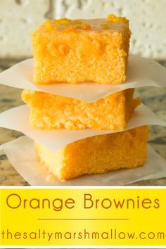 three orange brownies stacked on top of each other with the words orange brownies