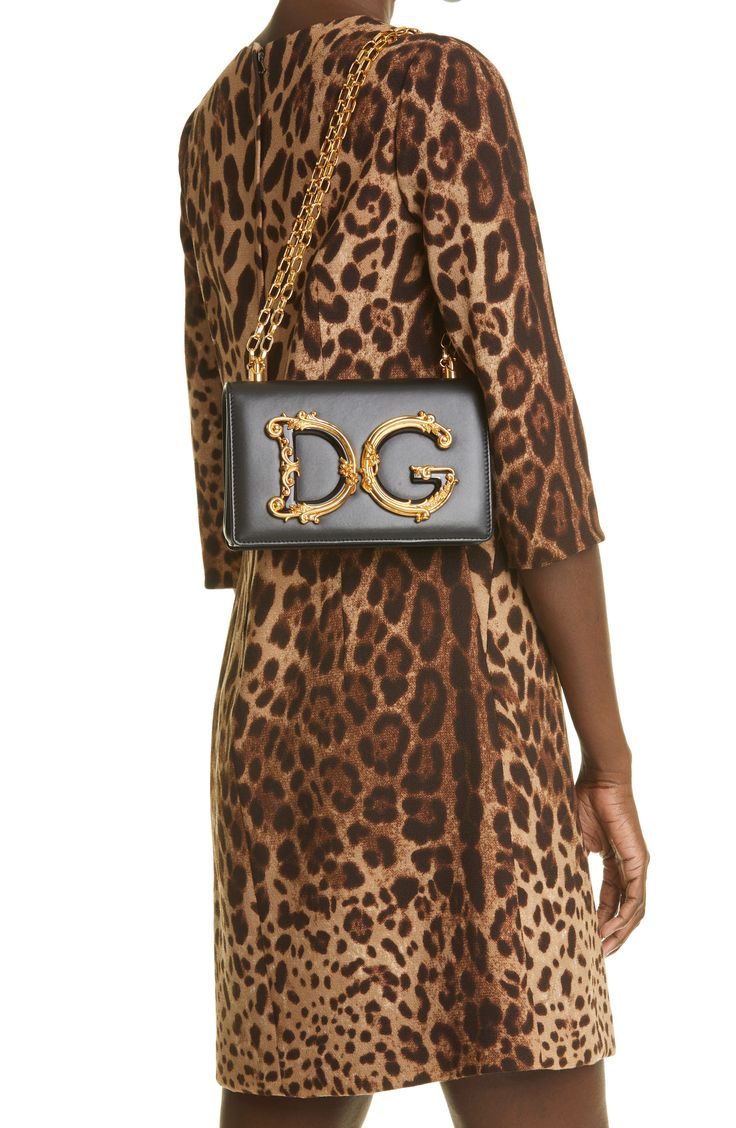 A Dolce&Gabbana logo embellished with Baroque-inspired gilt flourishes brings a vintage aesthetic to a structured crossbody bag crafted of smooth leather. Style Name:Dolce&gabbana Logo Leather Crossbody Bag. Style Number: 5964808. Evening Shoulder Bag With Top Handle And Logo Plaque, Luxury Evening Shoulder Bag With Logo Plaque, Elegant Crossbody Bag With Logo Plaque, Designer Gold Shoulder Bag With Logo Plaque, Gold Crossbody Bag With Logo Plaque, Gold Shoulder Bag With Logo Plaque For Evening, Gold Evening Shoulder Bag With Logo Plaque, Gold Evening Bag With Logo Plaque, Designer Gold Bag With Logo Plaque