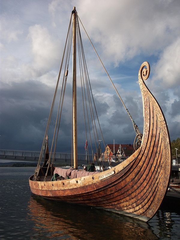 an old wooden boat sitting in the water