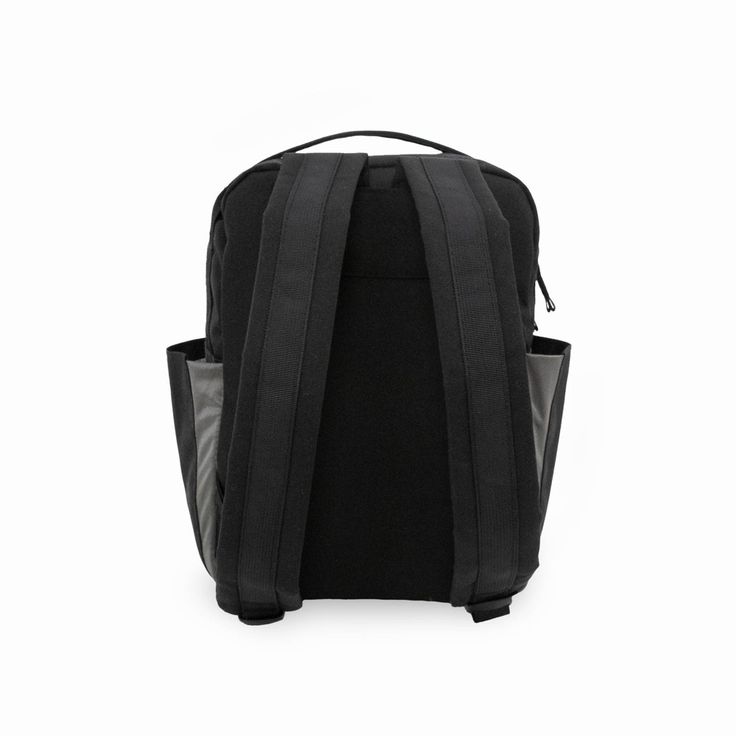 a black backpack on a white background with the back pocket open to show it's contents