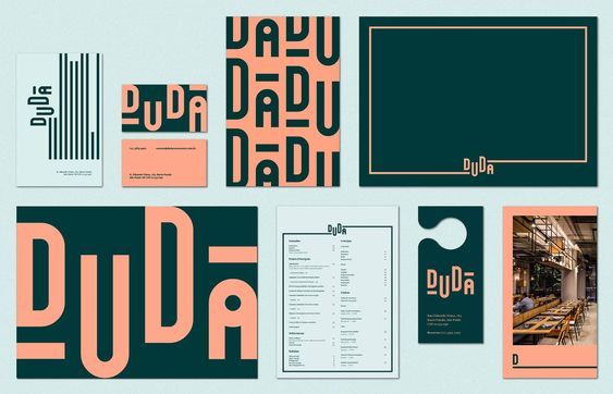 an assortment of business cards and stationery designed by graphic designer person for duda