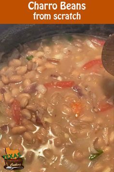 beans and carrots are being cooked in a pot