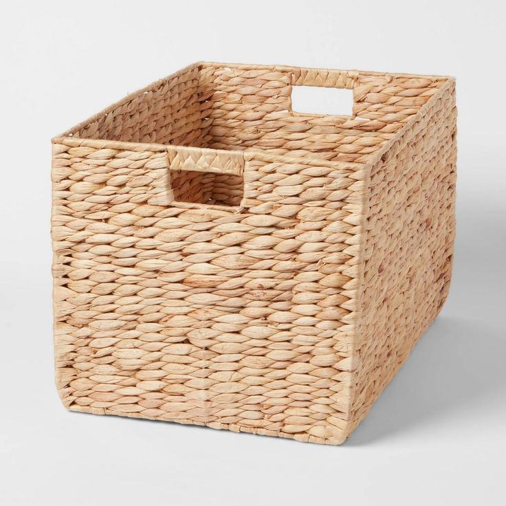 an empty wicker basket on a white background