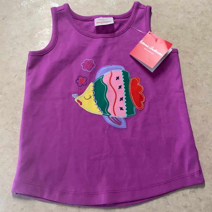 Hannah Andersson Purple Fish Tank Top. Size 100 (Us Size 4). New With Tags, Never Worn. Magenta Purple Tank Top Features Colorful Fish Appliqu And Embroidered Details. Cute Sleeveless T-shirt For Playwear, Sleeveless Cotton T-shirt For Playwear, Sleeveless Cotton Tops For Playtime, Purple Sleeveless Top For Playwear, Sleeveless Purple Tops For Playwear, Fun Cotton Tops For Playtime, Fun Sleeveless Top For Playtime, Multicolor Sleeveless Tops For Playtime, Pink Cotton Top For Play