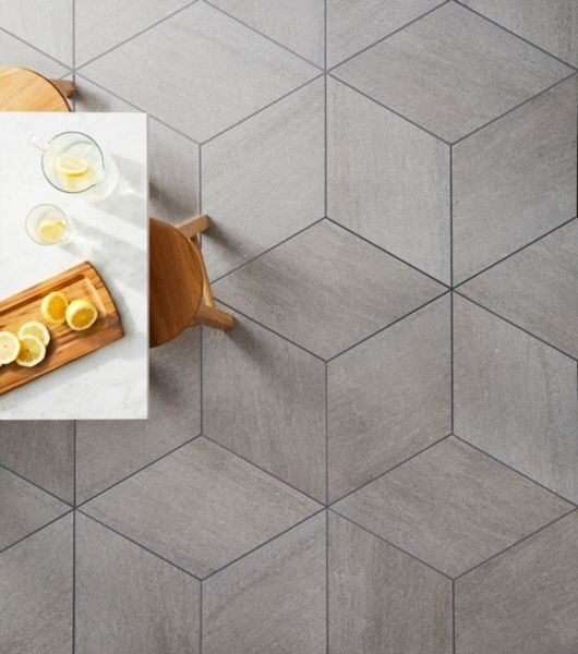 a table topped with sliced lemons on top of a wooden tray next to a cutting board