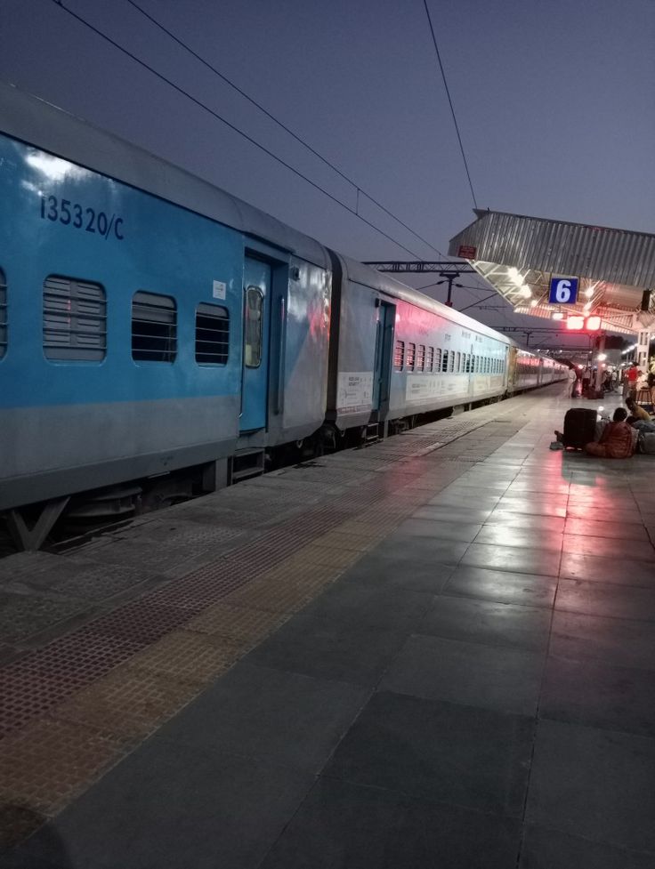 the train is stopped at the station waiting for passengers