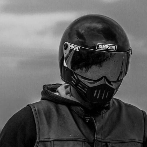 a person wearing a motorcycle helmet and jacket