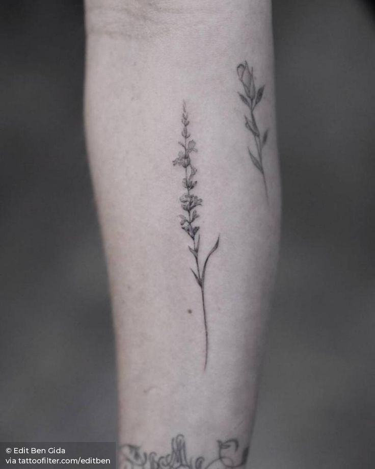 a small flower tattoo on the leg