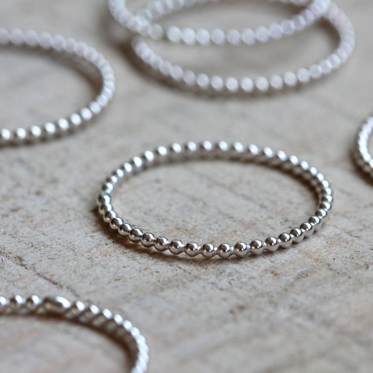 Sterling silver bead wire stacking rings. A set of 6 from Praxis Jewelry $48.00 Gold Circle Ring, Beaded Stacking Rings, Jewelry Mexican, Unique Silver Rings, Simple Silver Jewelry, Bead Wire, Jewelry Logo, Flower Engagement Ring, Engagement Rings Vintage Halo