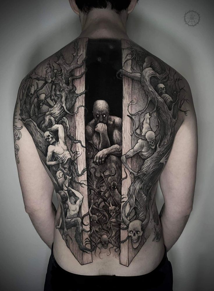 the back of a man's body with tattoos on it and an open door