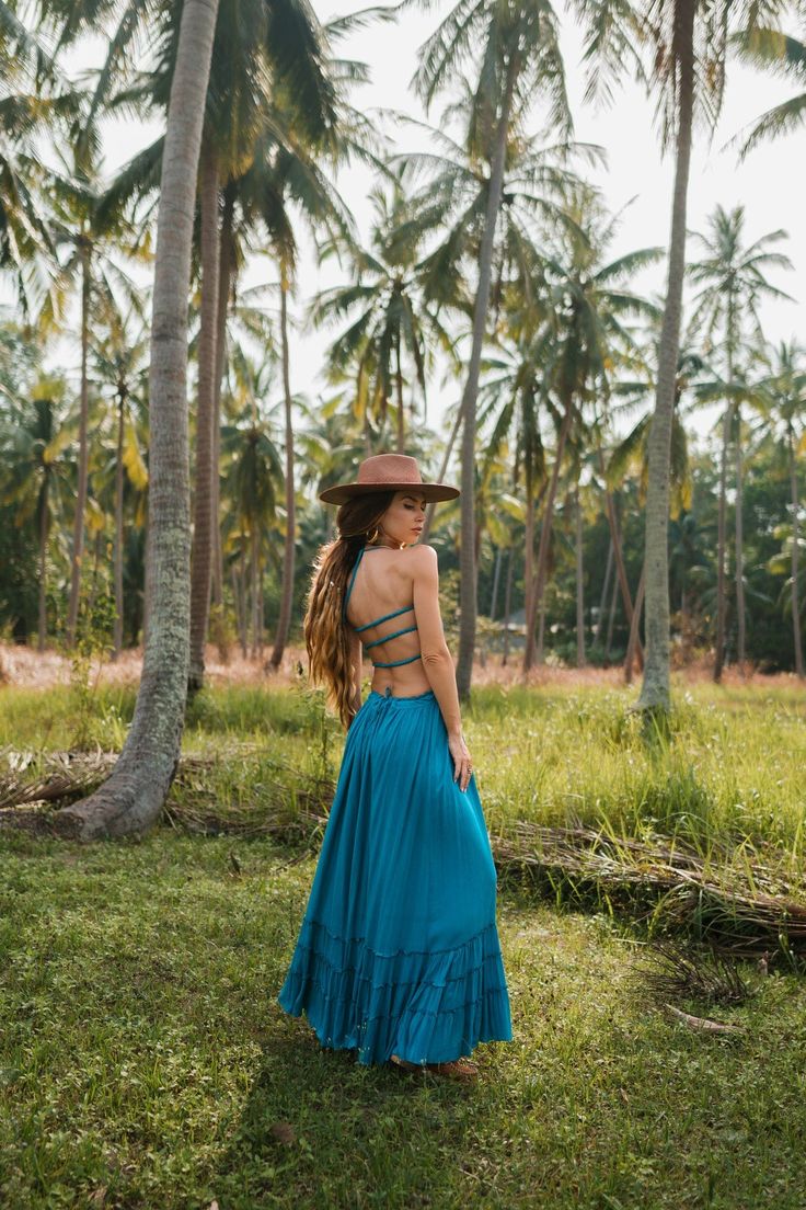 Backless long boho dress. This beautiful dress comes in several colors. Features ruffled edges on the bottom and a maxi silhouette. It has a tie in the back so it fits everyone, the sizing is really in the chest. If you have big breasts size up! Specs: Made from Cotton and Linen. Floor-length Tie Back Maxi Dress For Beach, Summer Maxi Dress With Tie Back, Bohemian Halter Neck Sundress With Ruffles, Bohemian Tiered Sundress With Smocked Back, Beachwear Maxi Sundress With Tie Back, Flowy Summer Maxi Dress With Tie Back, Vacation Backless Maxi Dress With Smocked Back, Beach Dresses With Ruffle Hem Maxi Length, Maxi Length Beach Dresses With Ruffle Hem