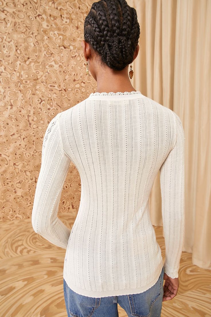 A layer-friendly beauty, our Delia Top is spun from the finest cotton and silk into a dynamic pointelle knit inspired by antique textiles. Imbued with a hint of stretch, this long-sleeve style has a classic crewneck, a close fit, and is a pearly white hue for optimal versatility. It fastens with a button front placket. Composition: 60% Silk, 40% Cotton Pair with our Willow Jean to complete the look. Nyc Boutiques, Alabaster White, Pointelle Knit, Antique Textiles, Signature Print, Knit Sweatshirt, Ulla Johnson, Event Dresses, Swimwear Accessories