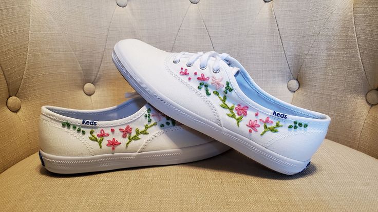 New hand embroidered, Classic Champion lace up Keds sneakers in pretty pink and green floral pattern! Embroidery features french knot and lazy daisy stitches. Timeless classic Keds fit with an adorable updated design idea. Original one of a kind pattern in size 7 1/2!  100% white, canvas shoe with rubber sole-timeless Keds! Lace up style with dream foam foot bed for all day comfort. Pair these with denim jeans or a dress or anything in between. We do not recommend machine washing to preserve the workmanship.  We are happy to ship in a new Keds box making these perfect for gifting! Please note these are size 7 1/2. Ready to ship immediately once payment clears with shipping insurance up to $100. We regret we cannot accept returns. We suggest keeping track of delivery date so package thief d Spring Sneakers With Embroidered Round Toe, Spring Embroidered Sneakers With Round Toe, Summer Lace-up Sneakers With Appliques, Spring Lace-up Sneakers With Embroidered Logo, Spring Embroidered Round Toe Sneakers, Summer Applique Lace-up Sneakers, Pink Sneakers With Embroidered Logo For Spring, Casual Sneakers With Custom Embroidery, Casual Custom Embroidery Lace-up Sneakers