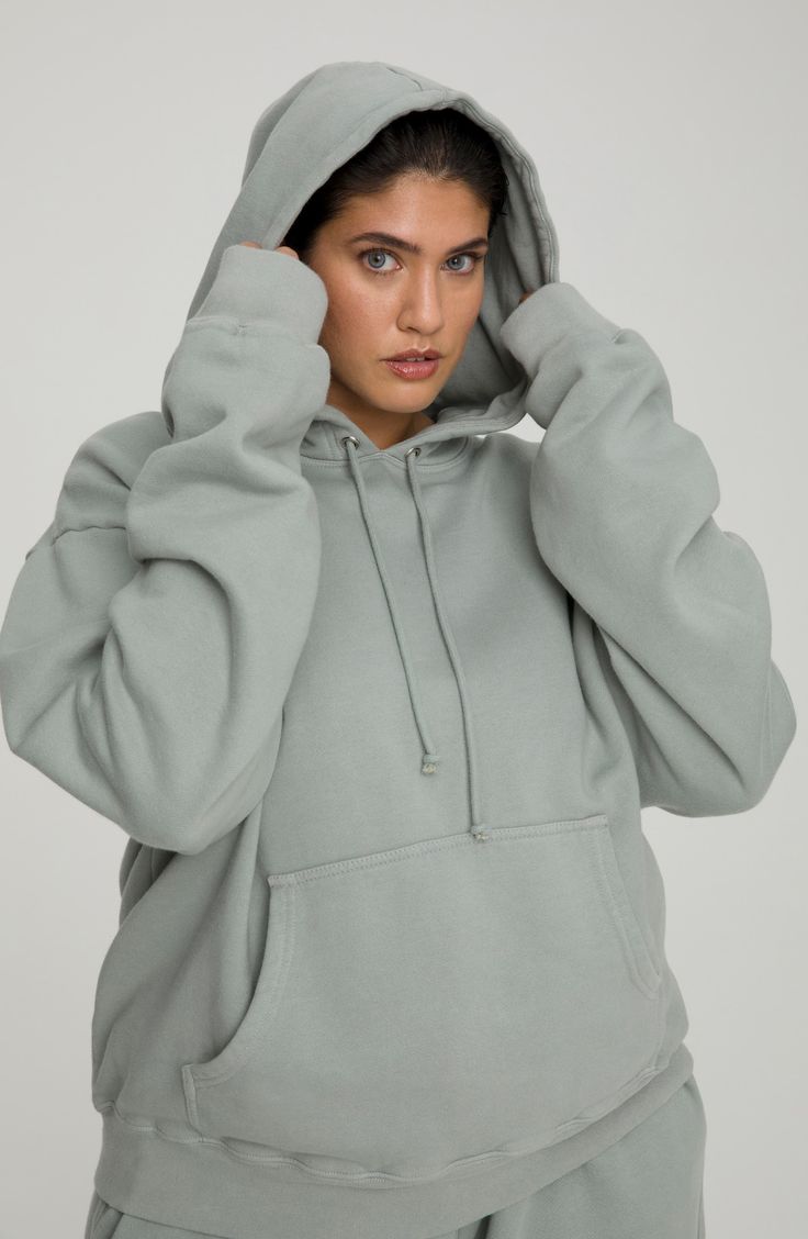 This cotton-knit hoodie offers plush comfort with an oversized fit that covers your backside and extra long sleeves. 27 1/2" length (size 5) Attached hood with drawstring Long sleeves Kangaroo pocket Ribbed accents Allover print 100% cotton Machine wash, tumble dry Made in USA Model stats: 5'10" height, 32" bust, 25" waist, 36" hip. Model is wearing size 5 Relaxed Fit Hooded Sweater With Ribbed Cuffs, Hooded Sweater With Ribbed Cuffs And Relaxed Fit, Relaxed Fit Hoodie With Drawstring For Loungewear, Comfy Relaxed Fit Sweats With Drawstring Hood, Relaxed Fit Hooded Cozy Sweats, Cozy Solid Sweats With Drawstring Hood, Cozy Hooded Sweats With Relaxed Fit, Cozy Relaxed Fit Hooded Sweats, Cozy Oversized Top With Kangaroo Pocket